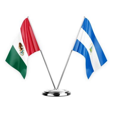 Two table flags isolated on white background 3d illustration, mexico and nicaragua
