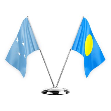 Two table flags isolated on white background 3d illustration, micronesia and palau