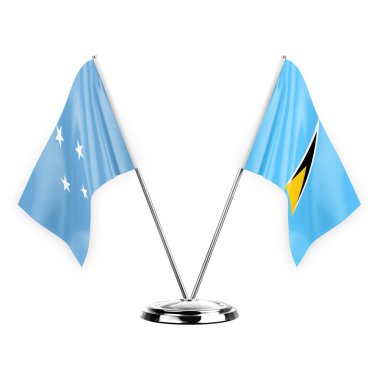 Two table flags isolated on white background 3d illustration, micronesia and saint lucia