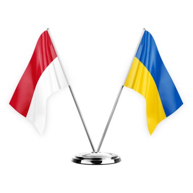 Two table flags isolated on white background 3d illustration, monaco and ukraine