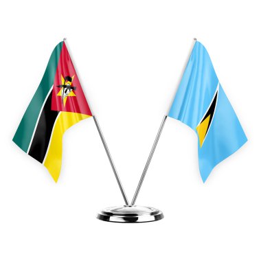 Two table flags isolated on white background 3d illustration, mozambique and saint lucia