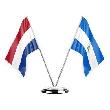 Two table flags isolated on white background 3d illustration, netherlands and nicaragua