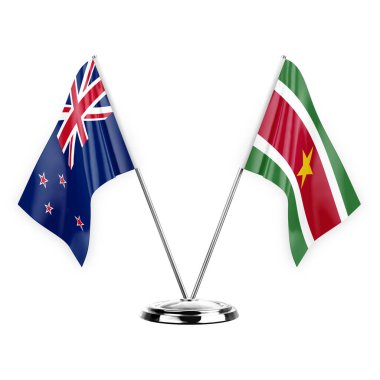 Two table flags isolated on white background 3d illustration, new zealand and suriname