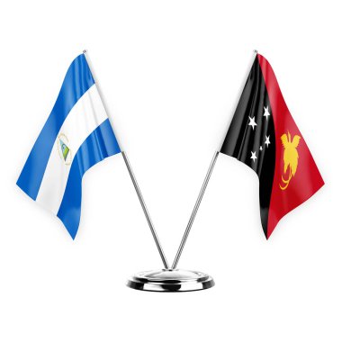 Two table flags isolated on white background 3d illustration, nicaragua and papua new guinea