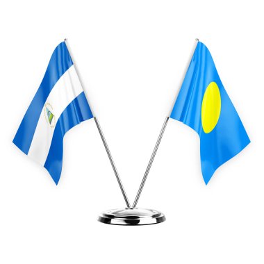 Two table flags isolated on white background 3d illustration, nicaragua and palau