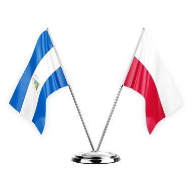 Two table flags isolated on white background 3d illustration, nicaragua and poland