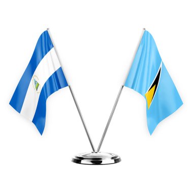 Two table flags isolated on white background 3d illustration, nicaragua and saint lucia