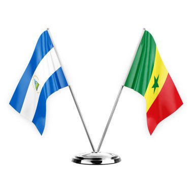 Two table flags isolated on white background 3d illustration, nicaragua and senegal
