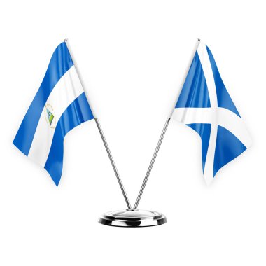 Two table flags isolated on white background 3d illustration, nicaragua and scotland