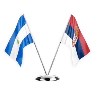 Two table flags isolated on white background 3d illustration, nicaragua and serbia