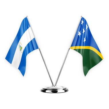 Two table flags isolated on white background 3d illustration, nicaragua and solomon islands