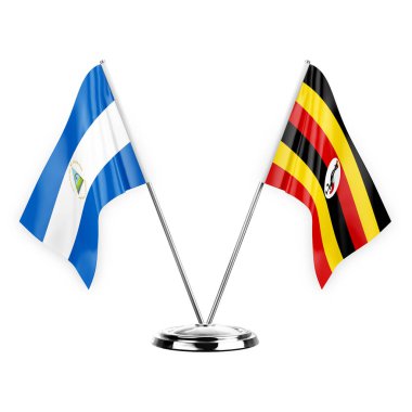 Two table flags isolated on white background 3d illustration, nicaragua and uganda