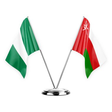 Two table flags isolated on white background 3d illustration, nigeria and oman