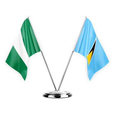 Two table flags isolated on white background 3d illustration, nigeria and saint lucia