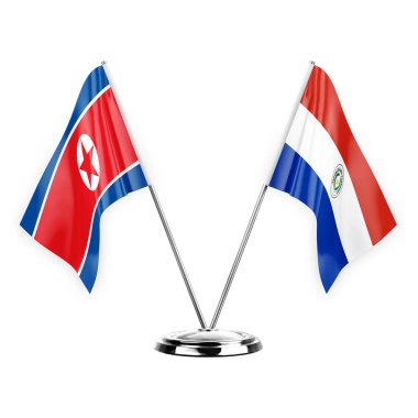 Two table flags isolated on white background 3d illustration, north korea and paraguay