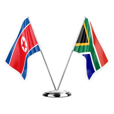 Two table flags isolated on white background 3d illustration, north korea and south africa
