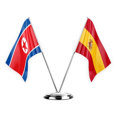 Two table flags isolated on white background 3d illustration, north korea and spain