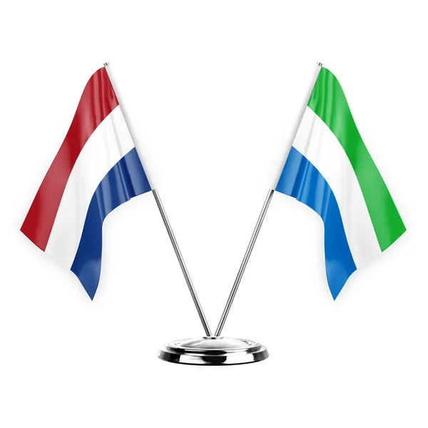 白い背景の3Dイラストに隔離された2つのテーブルフラグ オランダとシエラレオネ — ストック写真