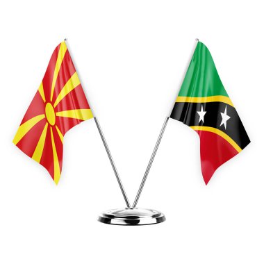 Two table flags isolated on white background 3d illustration, north macedonia and saint kitts and venis