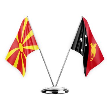 Two table flags isolated on white background 3d illustration, north macedonia and papua new guinea