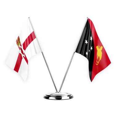 Two table flags isolated on white background 3d illustration, northern ireland and papua new guinea