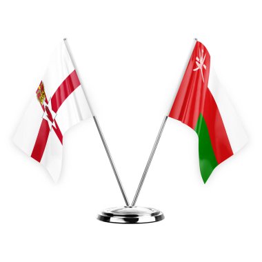 Two table flags isolated on white background 3d illustration, northern ireland and oman