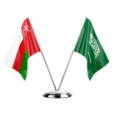 Two table flags isolated on white background 3d illustration, oman and saudi arabia