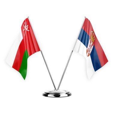 Two table flags isolated on white background 3d illustration, oman and serbia