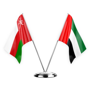 Two table flags isolated on white background 3d illustration, oman and united arab emirates