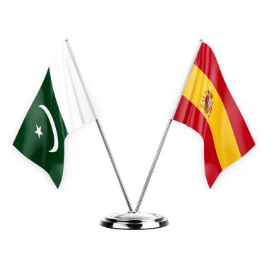 Two table flags isolated on white background 3d illustration, pakistan and spain