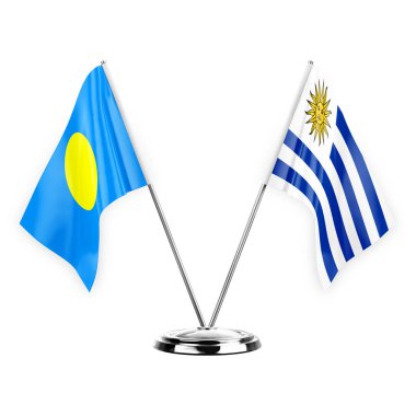 Two table flags isolated on white background 3d illustration, palau and uruguay