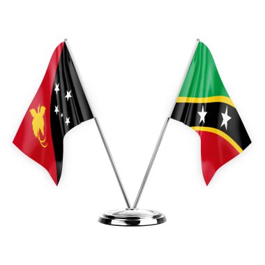 Two table flags isolated on white background 3d illustration, papua new guinea and saint kitts and venis