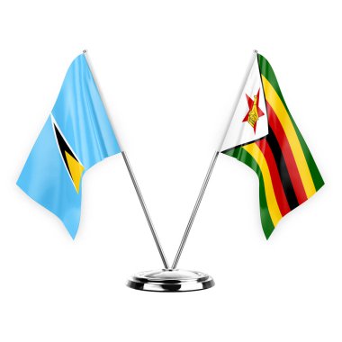 Two table flags isolated on white background 3d illustration, saint lucia and zimbabwe