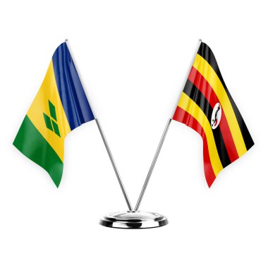 Two table flags isolated on white background 3d illustration, saint vincent and the grenadines and uganda