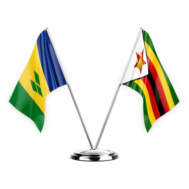 Two table flags isolated on white background 3d illustration, saint vincent and the grenadines and zimbabwe