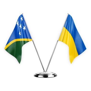Two table flags isolated on white background 3d illustration, solomon islands and ukraine