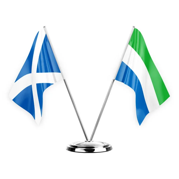白い背景の3Dイラストに隔離された2つのテーブルフラグ スコットランドとシエラレオーネ — ストック写真