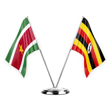 Two table flags isolated on white background 3d illustration, suriname and uganda