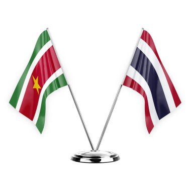 Two table flags isolated on white background 3d illustration, suriname and thailand