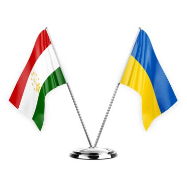 Two table flags isolated on white background 3d illustration, tajikistan and ukraine