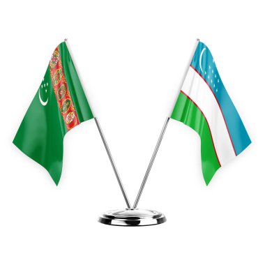 Two table flags isolated on white background 3d illustration, turkmenistan and uzbekistan