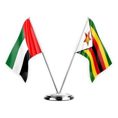 Two table flags isolated on white background 3d illustration, united arab emirates and zimbabwe