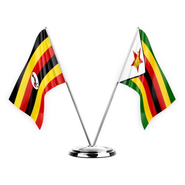 Two table flags isolated on white background 3d illustration, uganda and zimbabwe