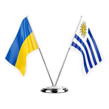 Two table flags isolated on white background 3d illustration, ukraine and uruguay