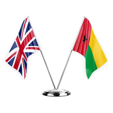 Two table flags isolated on white background 3d illustration, united kingdom and guinea-bissau