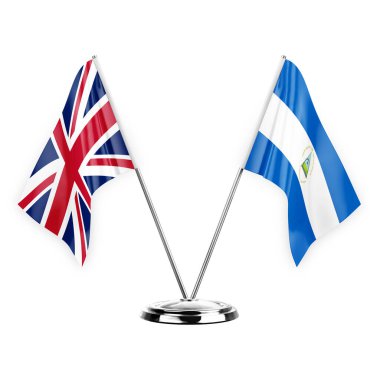 Two table flags isolated on white background 3d illustration, united kingdom and nicaragua