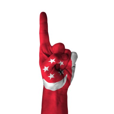 Hand pointing thumb up direction, singapore painted with flag as symbol of up direction, first and number one symbol - isolated on white background