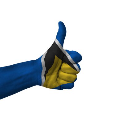 Hand making thumbs up sign, saint lucia painted with flag as symbol of thumbs up, like, okay, positive  - isolated on white background