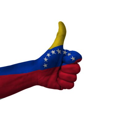 Hand making thumbs up sign, venezuela painted with flag as symbol of thumbs up, like, okay, positive  - isolated on white background