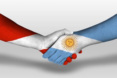 Handshake between argentina and austria flags painted on hands, illustration with clipping path.
